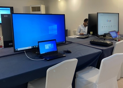 Technology setup with laptops at Dubai World Governments Summit 2025