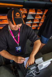 One World Rental staff managing EPOS tills and receipt printers at Melbourne F1 Grand Prix